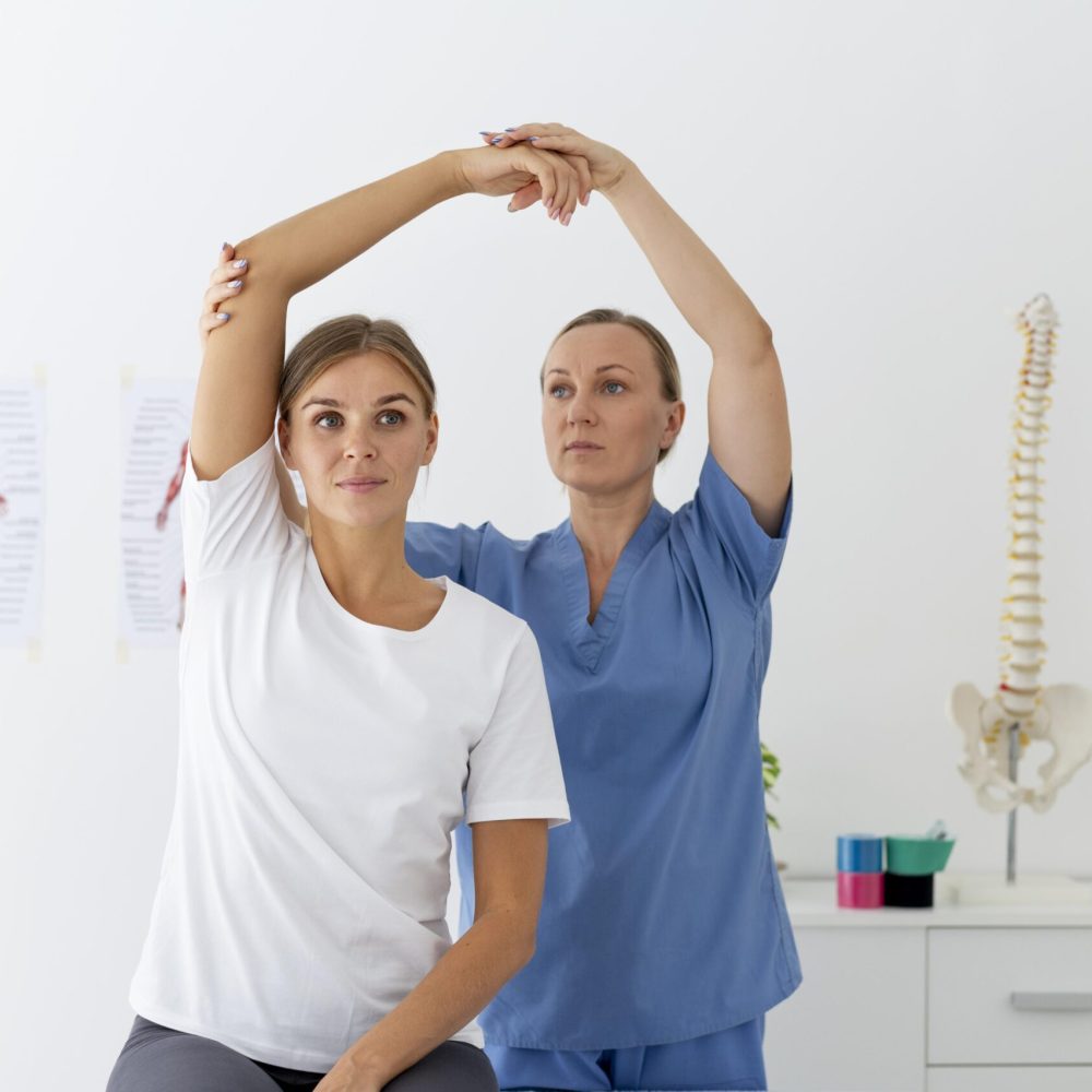 physiotherapist-helping-female-patient-her-clinic